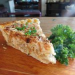 Slice of onion pie with parsley